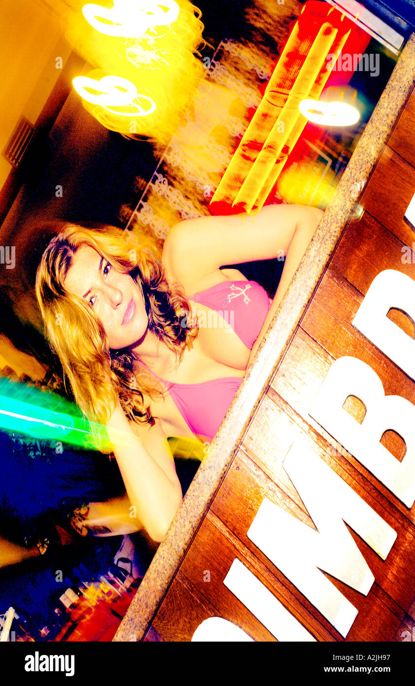 Brazilian girl wearing a bikini in a bar at night Stock Photo