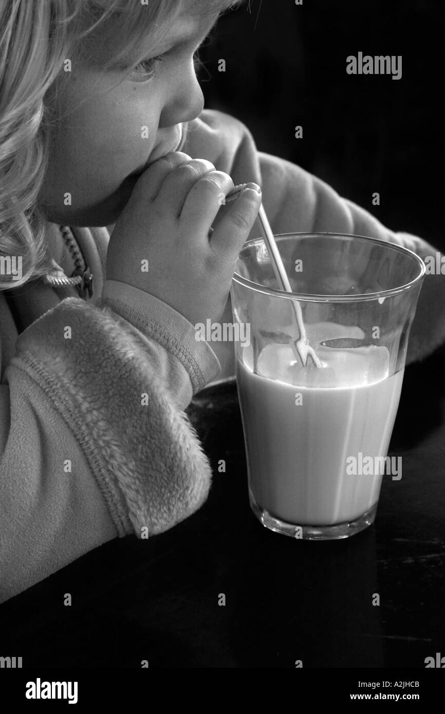young girl drinking milk Stock Photo Alamy