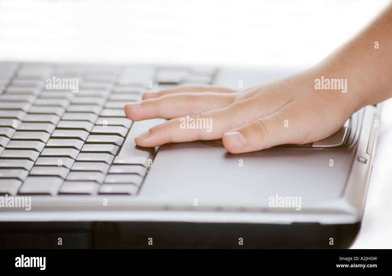 Kid Computer Hand Child and computer Stock Photo - Alamy