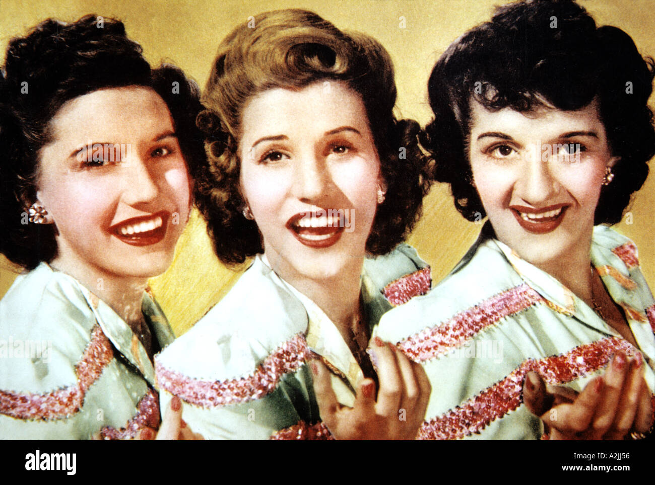 ANDREWS SISTERS American close harmony group who appeared in several films in the 1940s. from left Maxene, Patty and LaVerne Stock Photo