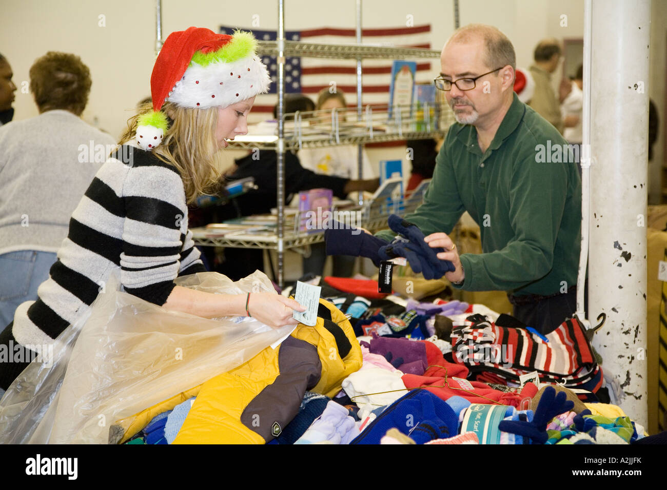 Volunteers Sort Clothing for Needy Families Stock Photo
