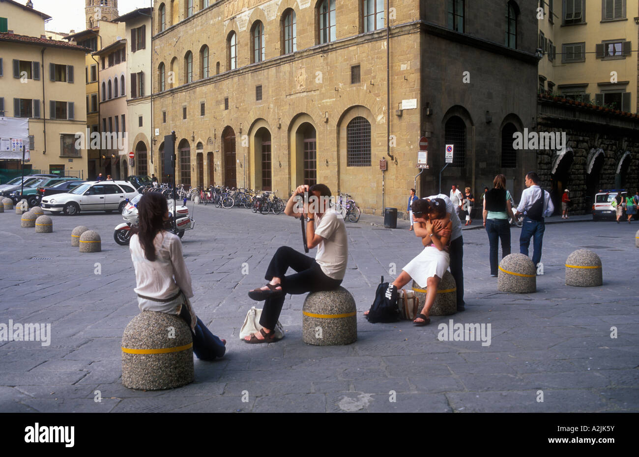 Italy Florence Piazza della Signoria couple photographing each other with other couple embracing Stock Photo