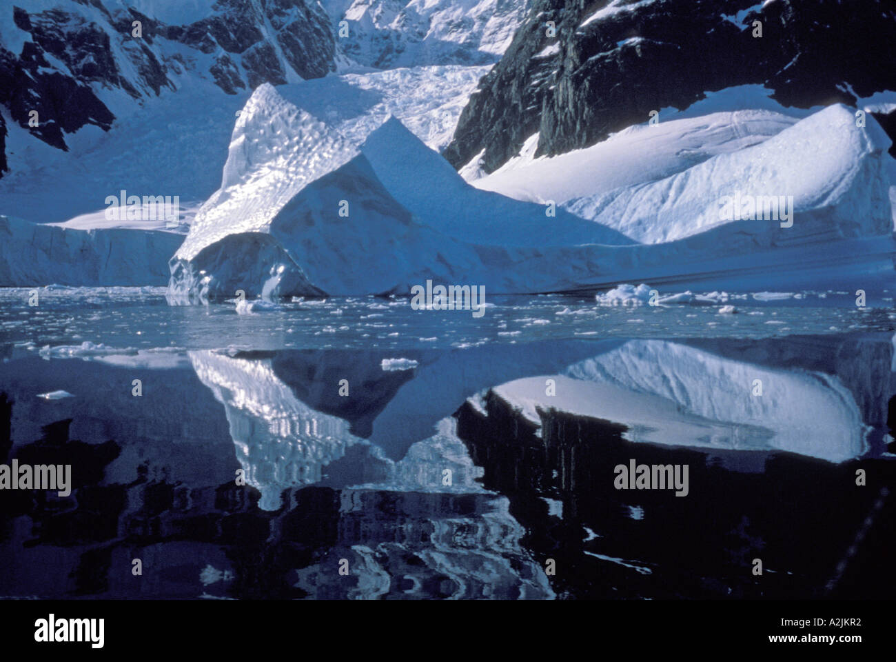 Antarctica. Ice forms against still reflection Stock Photo - Alamy