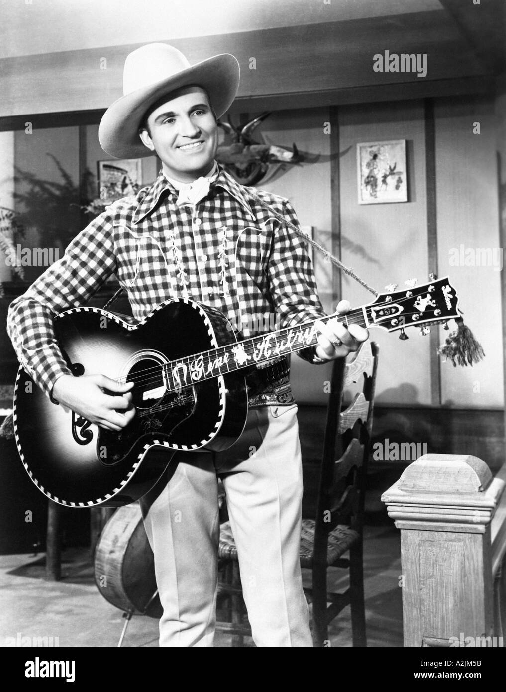 GENE AUTRY US Country singer and actor with his Gibson guitar Stock Photo