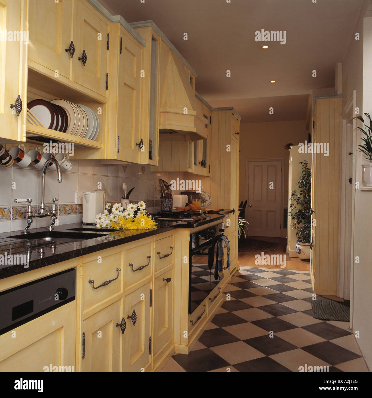 Black And White Flooring In Cream Kitchen Stock Photo Alamy