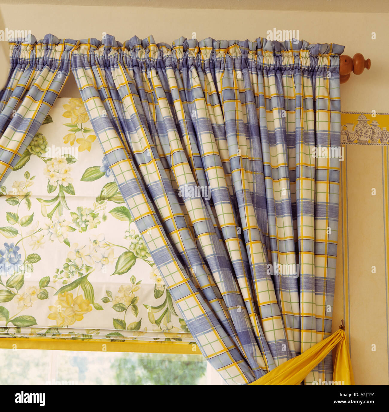 Close-up of blue checked curtains and floral blind Stock Photo - Alamy