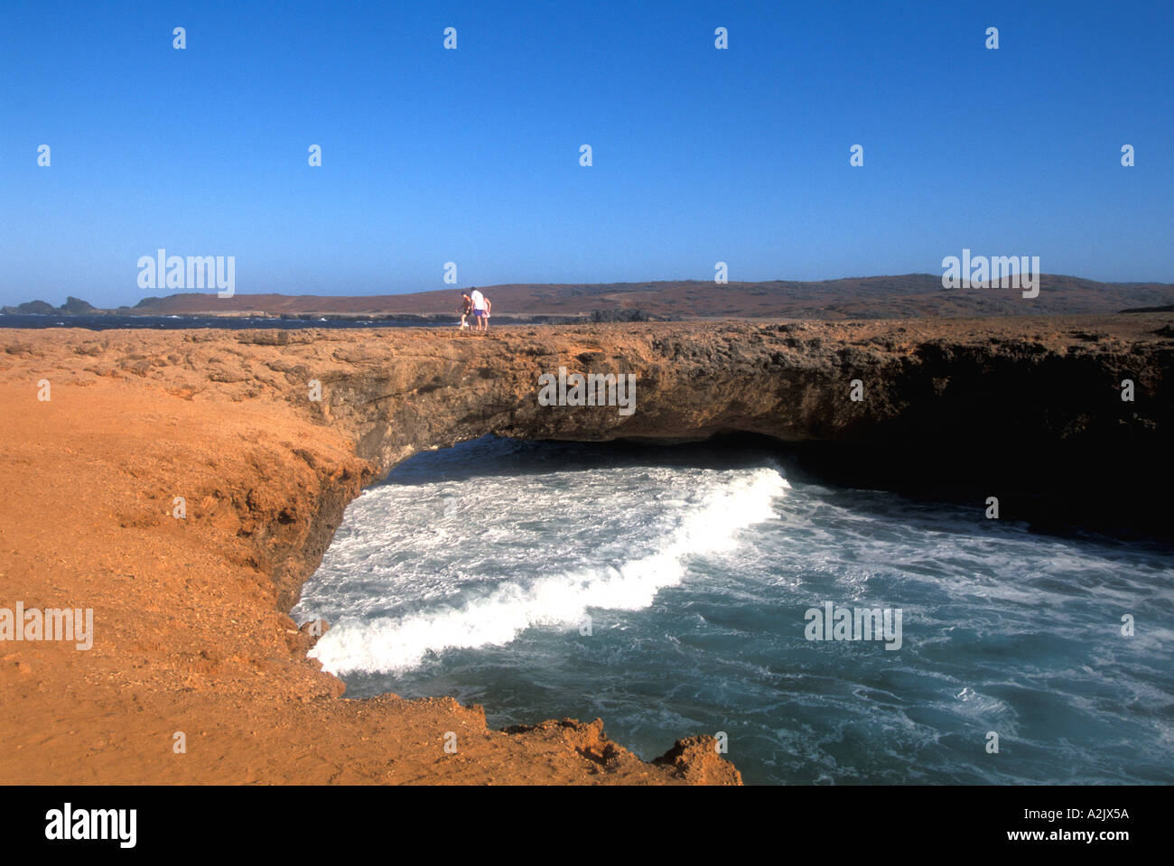 Aruba Natural Bridge Family of Tourists on Bridge Stock Photo