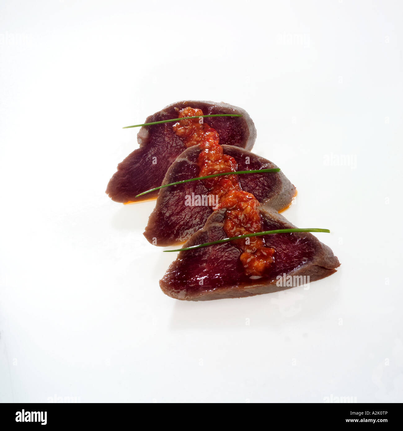 Japanese style fillet steak with sauce and chives to garnish Stock Photo