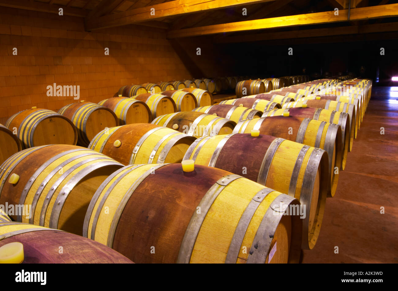 The barrel aging cellars with rows of oak barrels. All are 