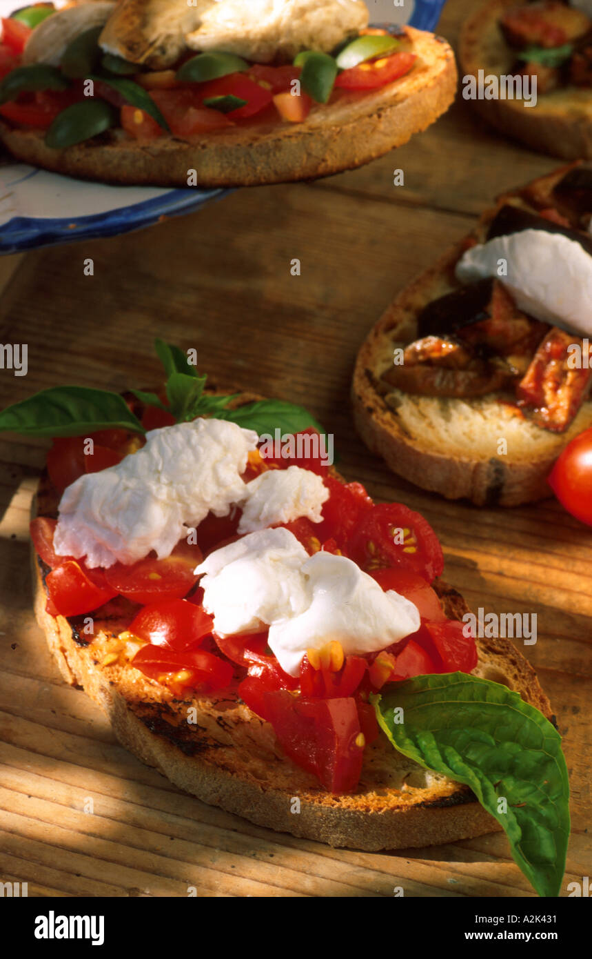 Bruschette with tomatoes and mozzarella di bufala Stock Photo Alamy