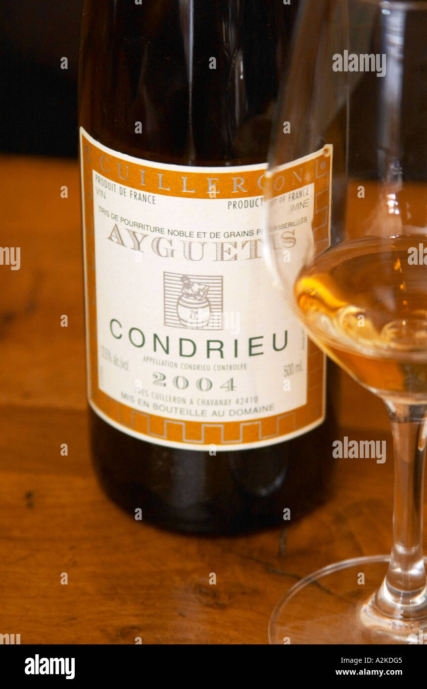 A bottle and a glass of Ayguets Condrieu 2004 - a very unusual sweet Condrieu made from grapes with noble rot (porriture noble) Stock Photo