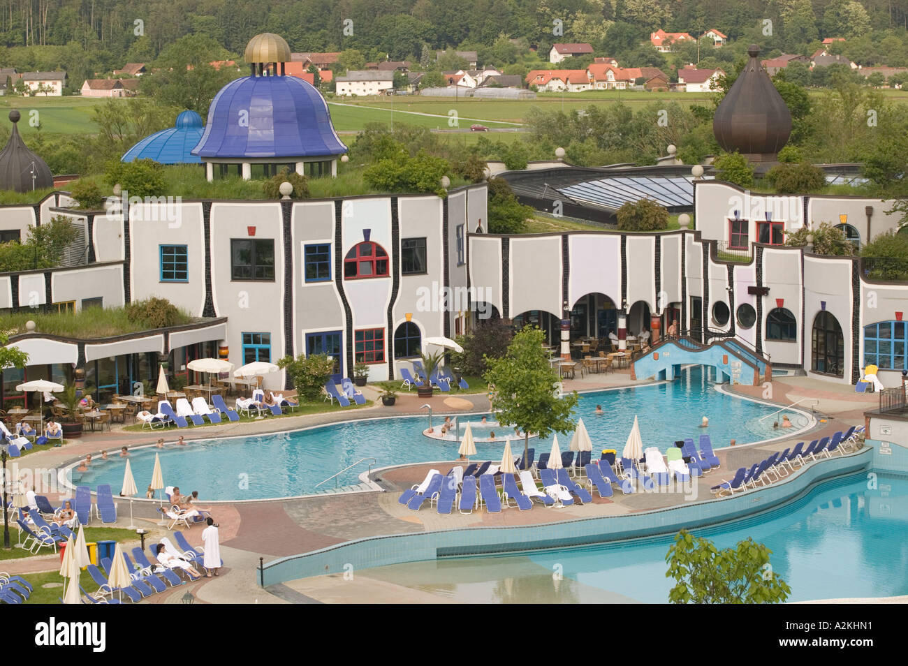 Austria, Styria, Stiermark. Rogner, Bad Blumau Hotel (b.1997) by Friedens Reich Hundertwasser, Pool View Stock Photo