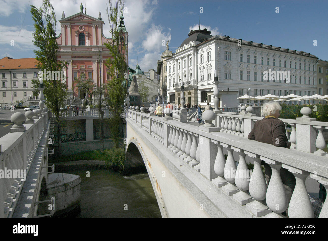 stone bridge over the Ljubljanica river in the historic center of Ljubljana Stock Photo