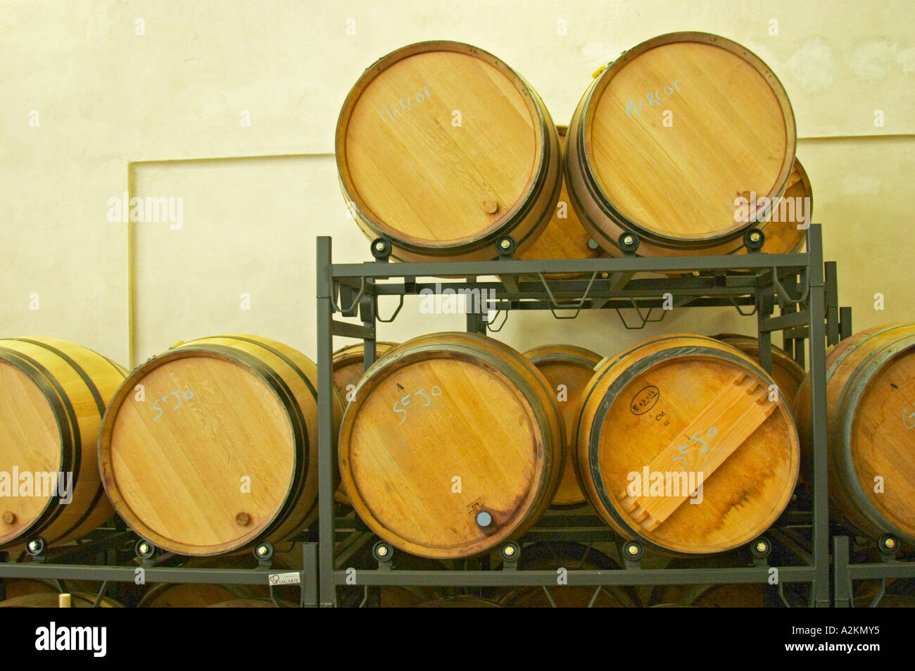 Wooden barrels mounted on special stands with rollers to make it easier to stir the lees as an alternative to stirring with a stick batonnage Vincent Paris Cornas Ardeche Ardeche France Europe