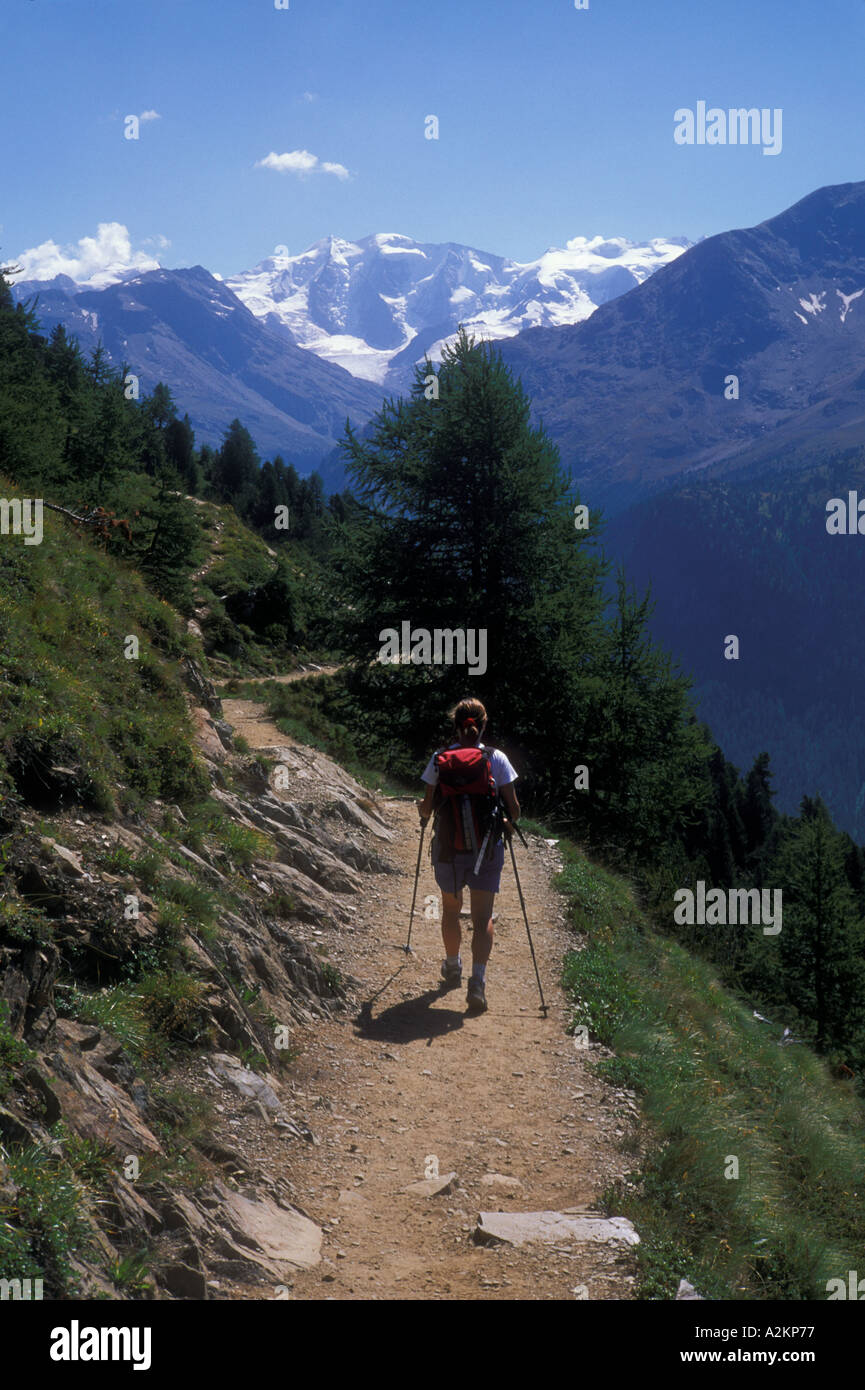 A woman hikes along a trail in Switzerland Stock Photo - Alamy