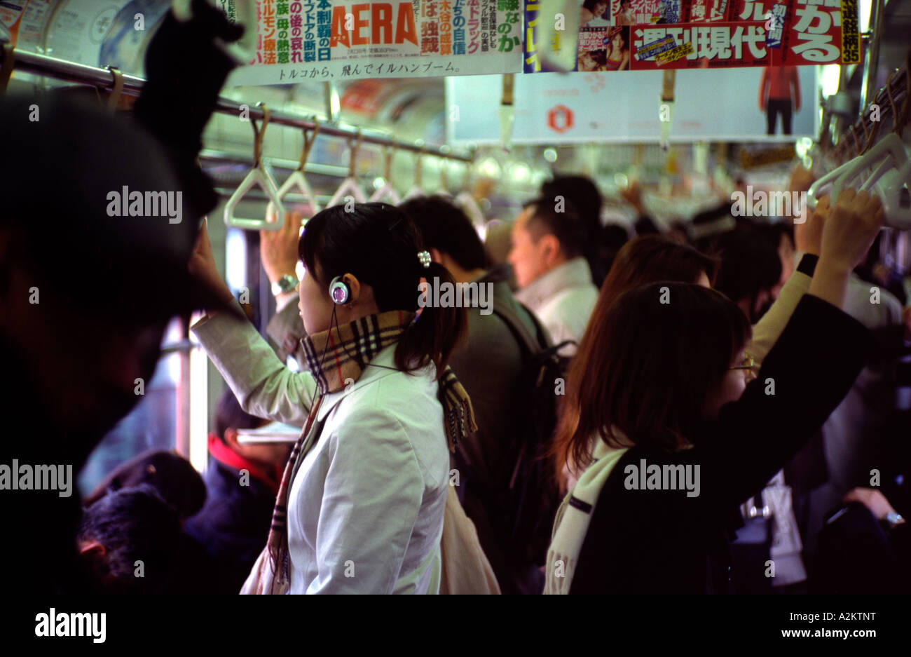 Commuters on their way home after work on Tokyo's Yamanote Line. Stock Photo