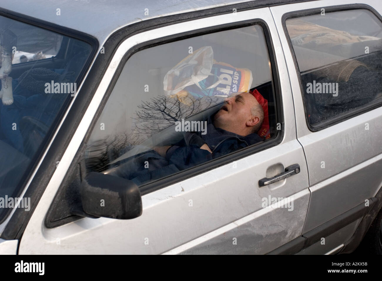 Sleeping In Car >> Man Sleeping In Car In A Rest Area Along The Autobahn In Sleeping In Car >> Man Sleeping In Car In A Rest Area Along The Autobahn In