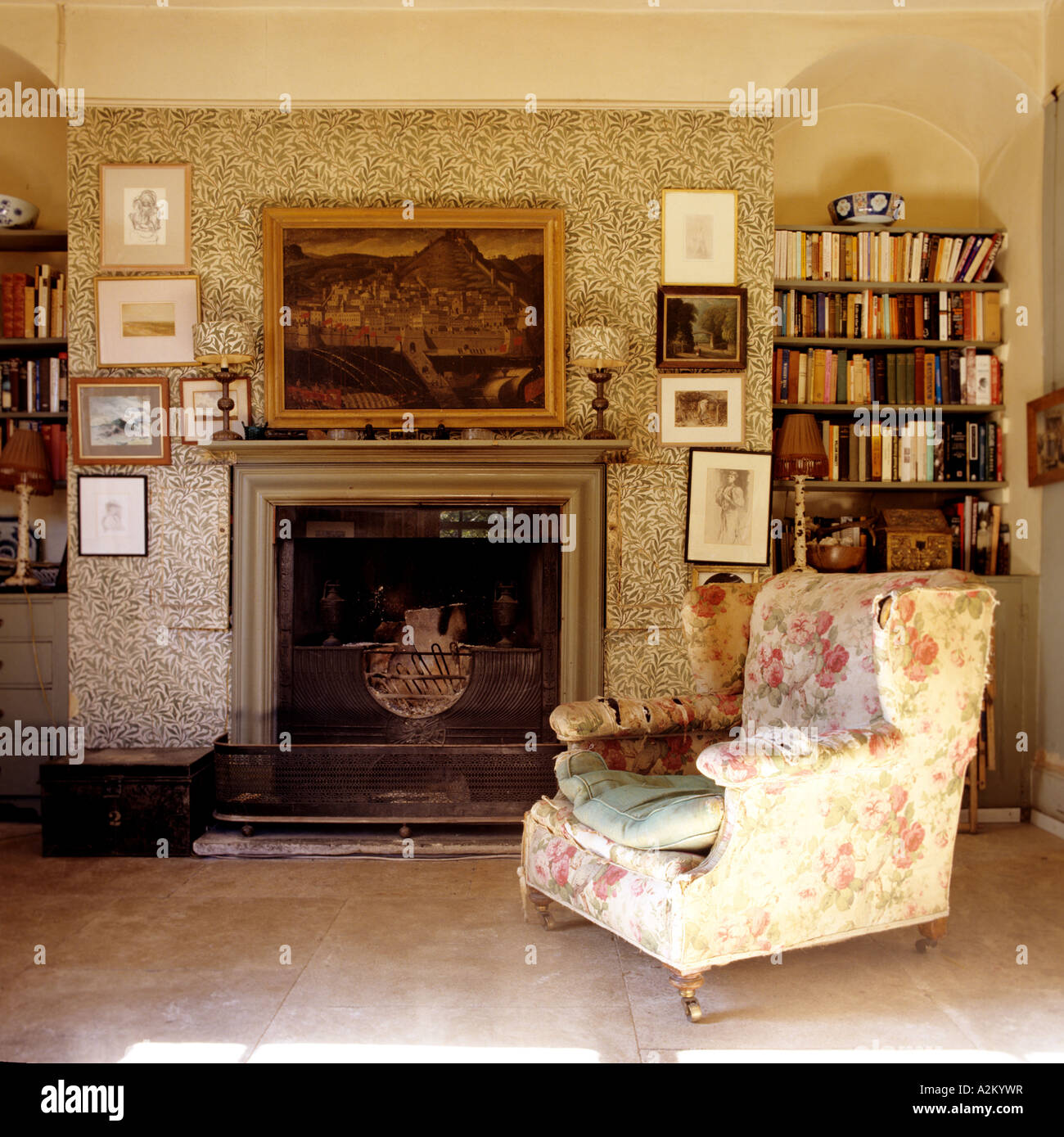 Floral armchair in living room with William Morris wallpaper Stock Photo