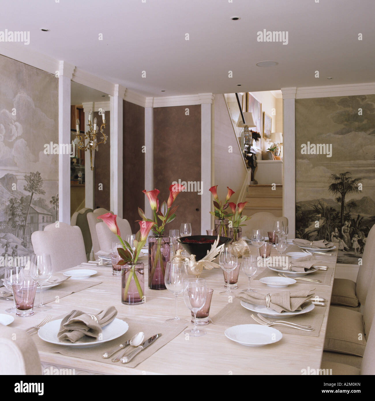 a London dining room with set table and panoramic wallpaper, interior design by Emily Todhunter Stock Photo