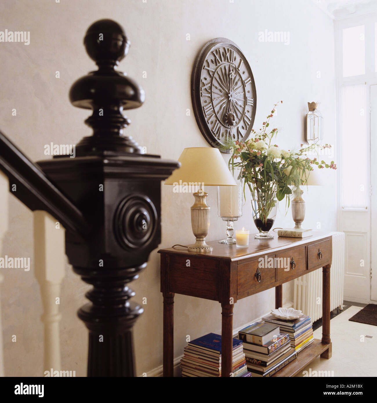 Entrance hall with console table and bannister Stock Photo