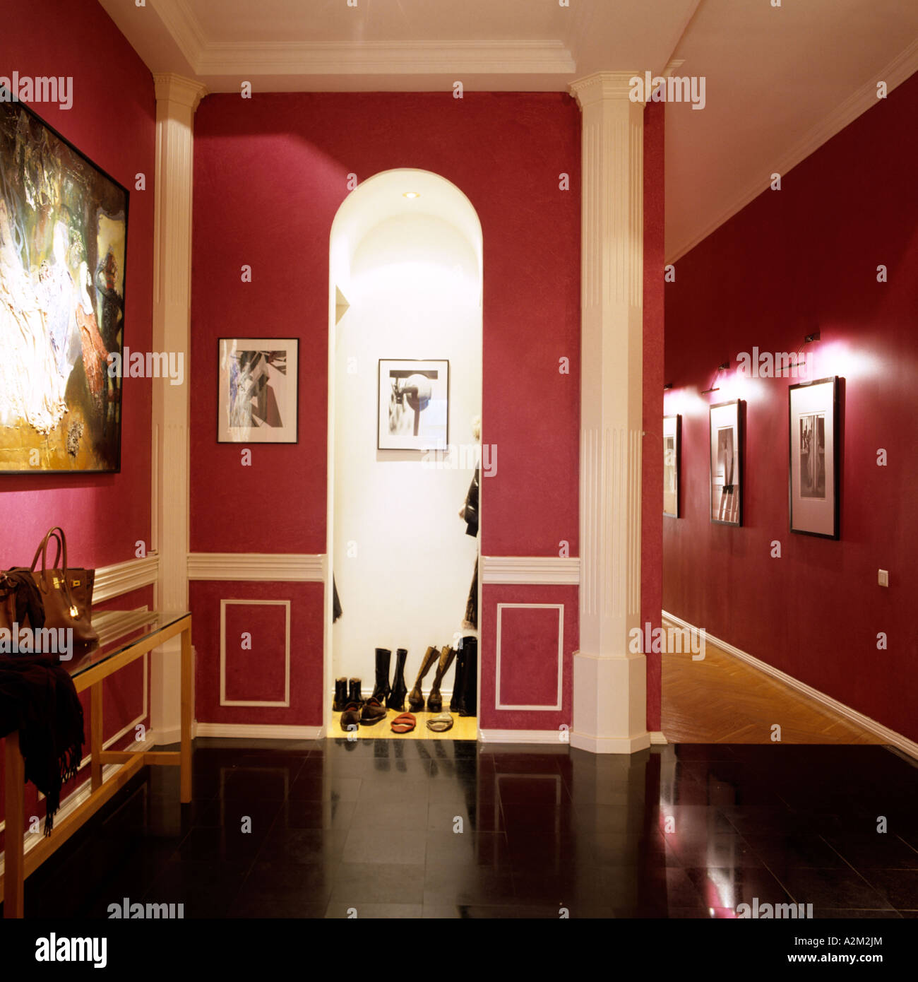 Arched doorway and hall of red painted apartment of St Petersburg art dealer Stock Photo