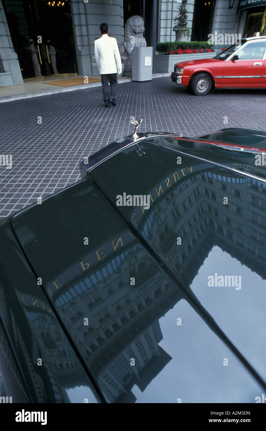 Peninsula hotel reflected on Rolls Royce bonnet Kowloon Hong Kong China