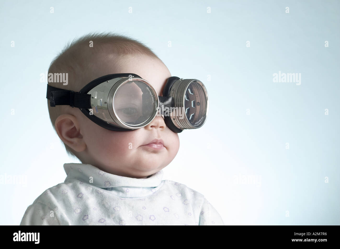 portrait-of-6-month-old-baby-girl-wearing-welders-goggles-over-eyes-A2M7R6.jpg