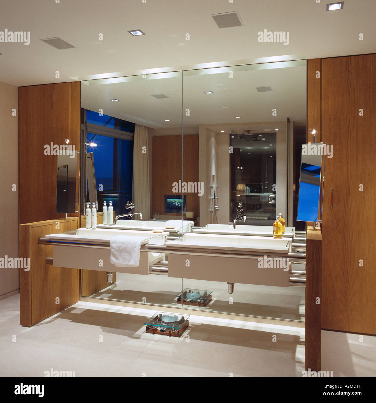 Bathroom with two wash basins and large mirrors in modern Thames penthouse apartment, London Stock Photo