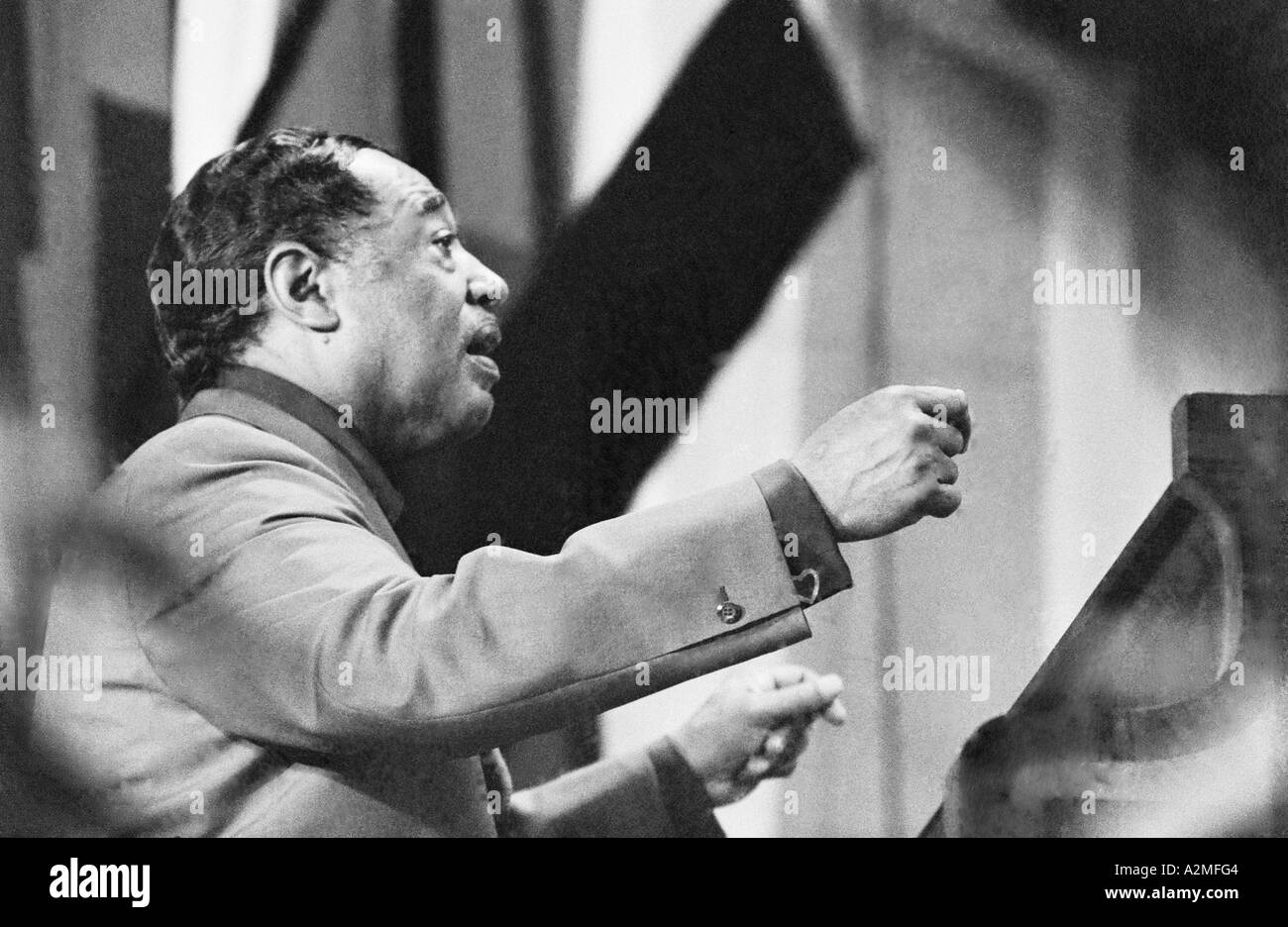 Duke Ellington leads the orchestra as he also plays at the Antibes Jazz Festival in 1966. Stock Photo