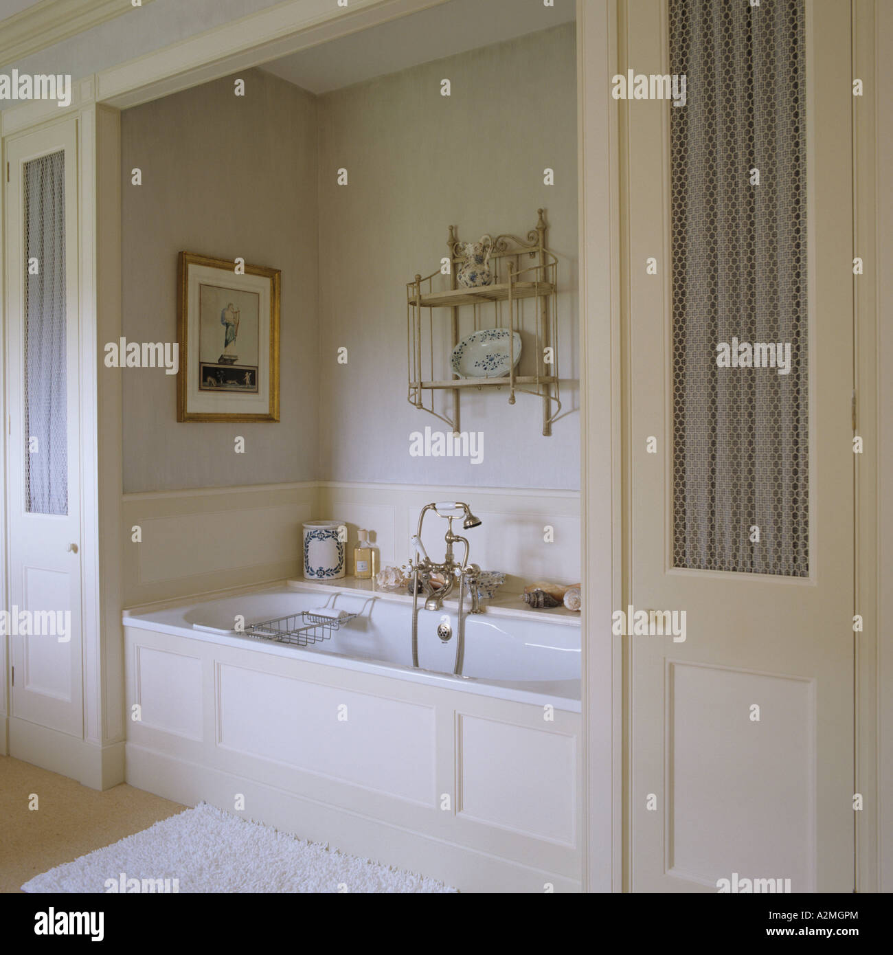 alcove with bath in bathroom of English country house Stock Photo