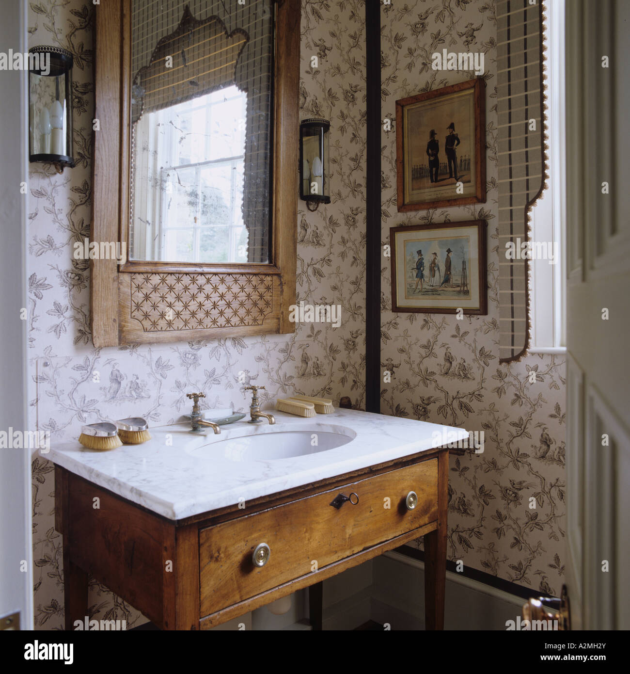 Marble-topped washstand in bathroom of English country house Stock Photo