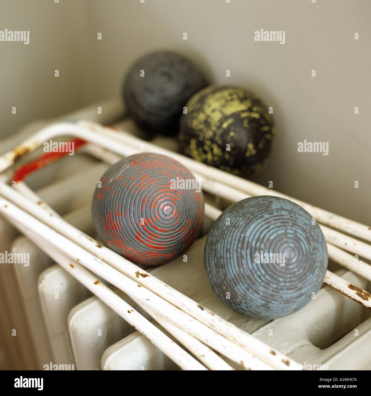 Old fashioned croquet set on cast iron radiator Stock Photo Alamy