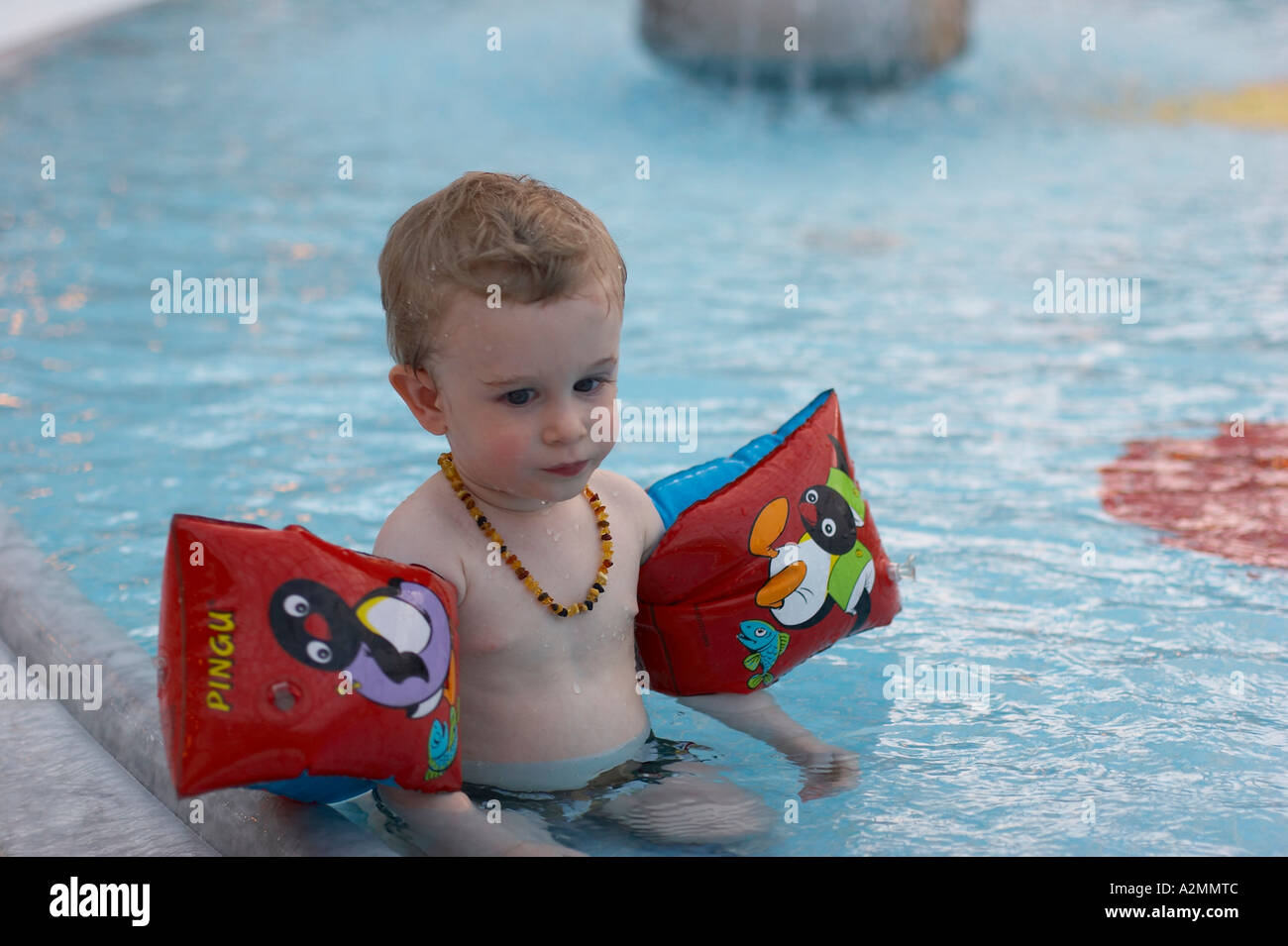 baby with water wings Stock Photo Alamy