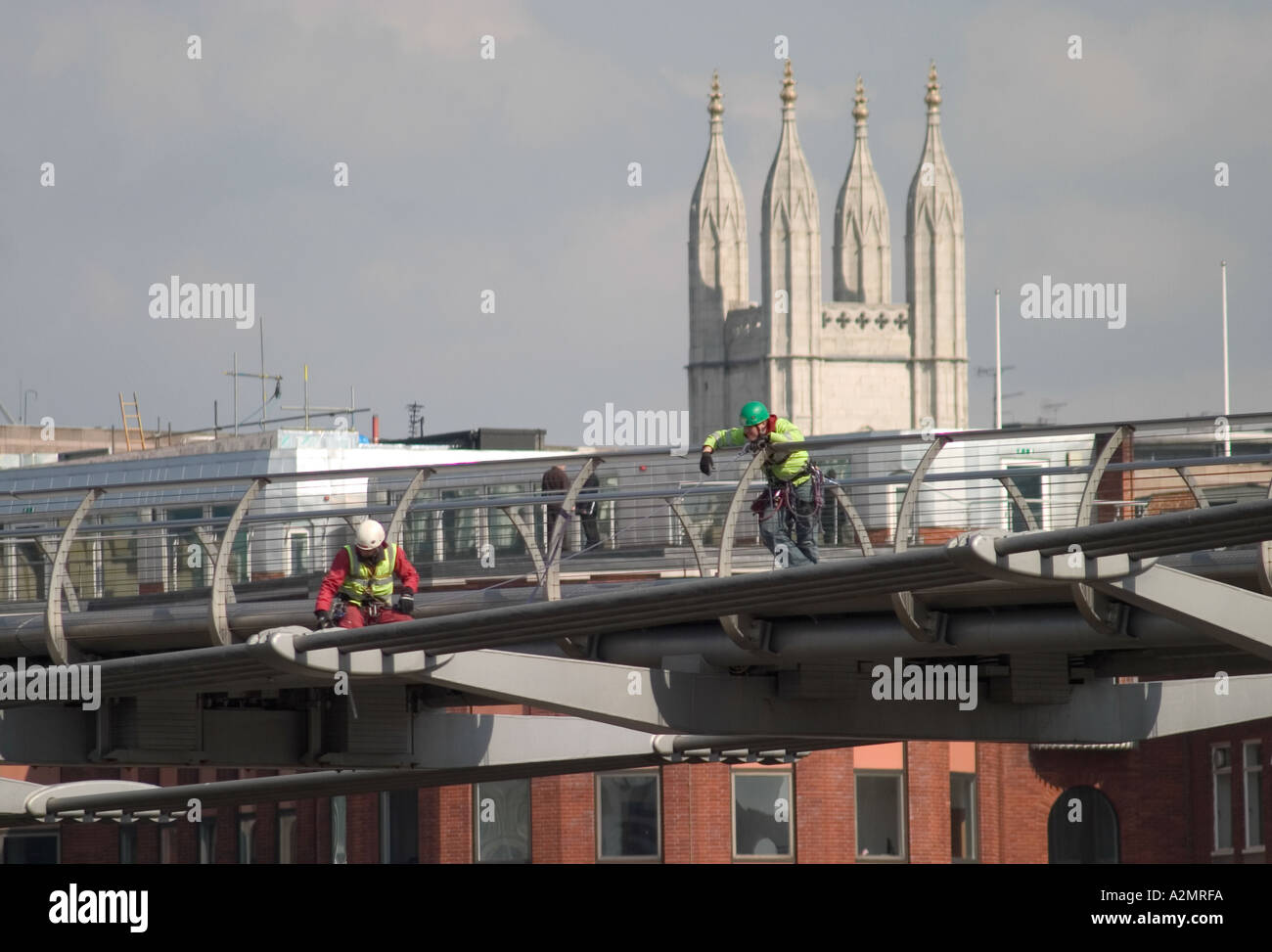 Workmen conducting safety checks on closed millennium bridge London