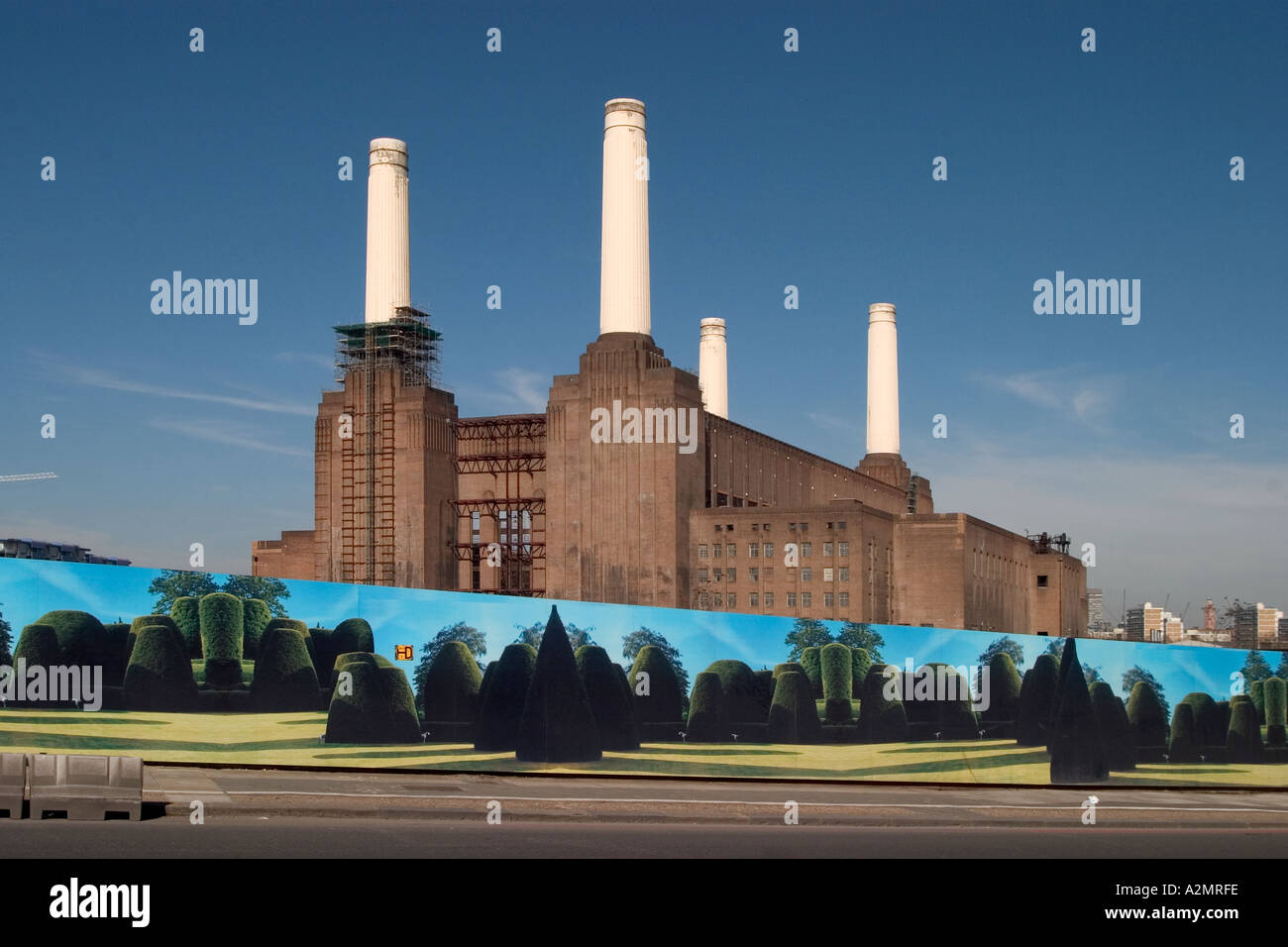 Battersea Power Station contrasts with building site hoarding of
