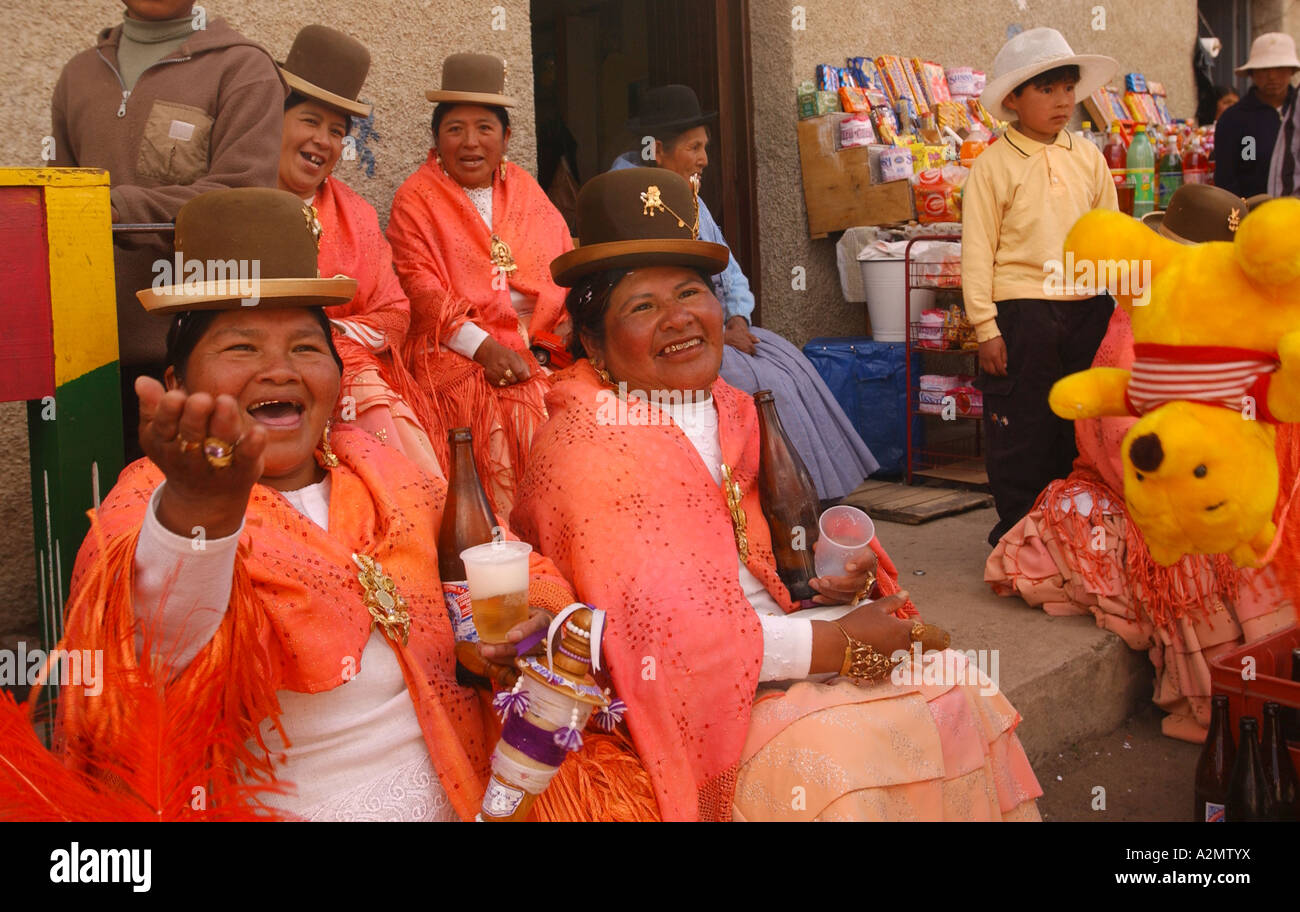 Bolivian women enjoying a fiesta in San Pedro, a town on the Copacabana Peninsula on the shore of Lake Titicaca. Stock Photo