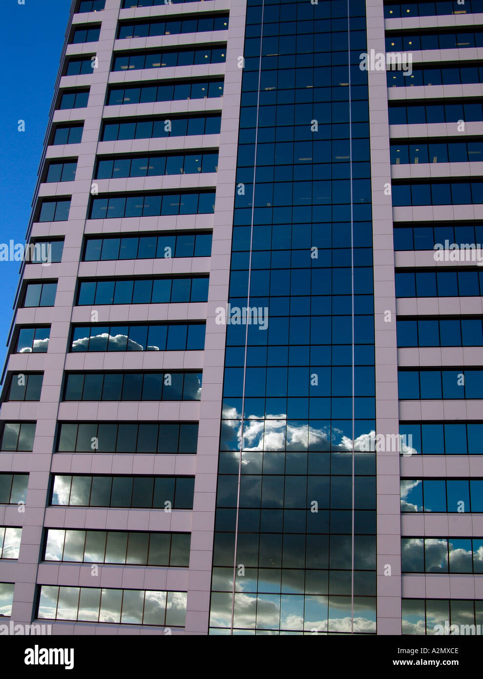 clouds and sky reflected in a glass clad modern office block Stock ...