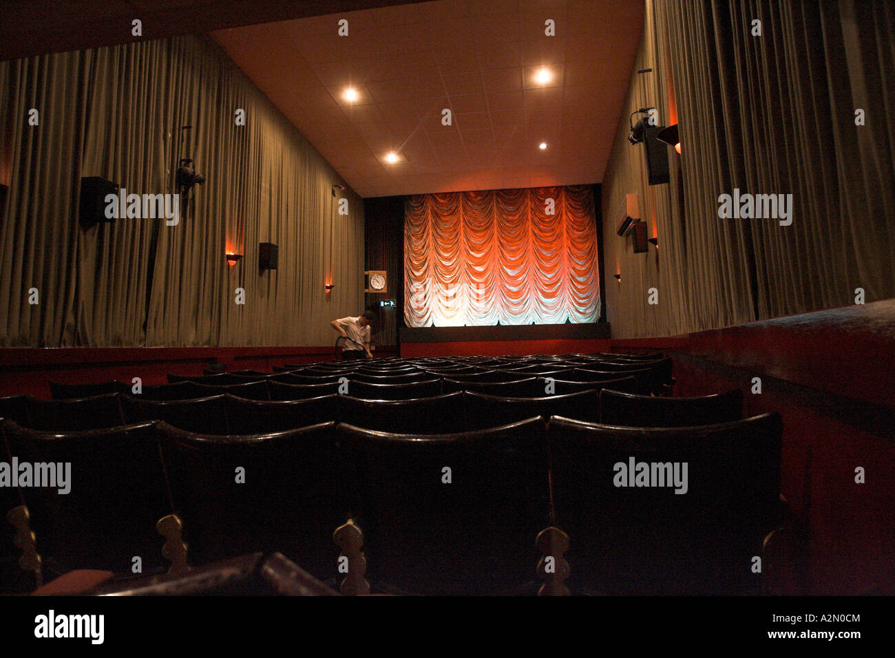 Royalty Cinema inside projection room & projectionist & projector Stock