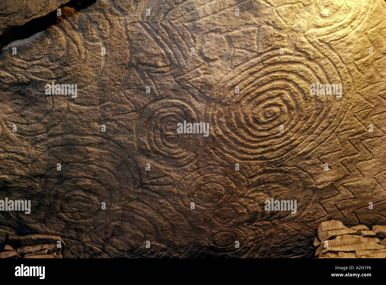 Newgrange prehistoric burial mound, Boyne Valley, Ireland. Carved spiral and chevron motifs on ceiling of the central chamber. Stock Photo