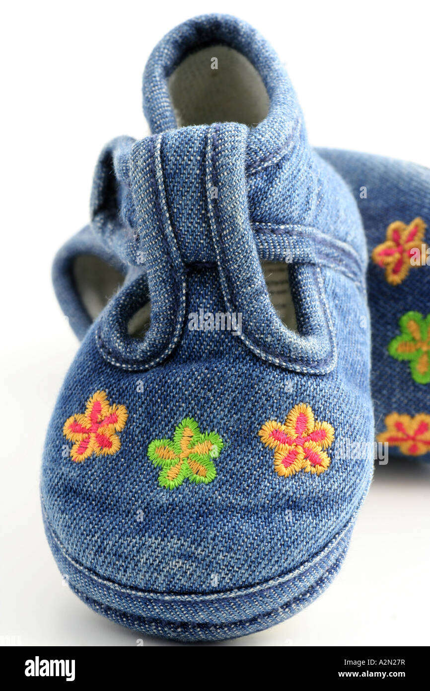 Blue denim t bar style baby shoes. Stock Photo