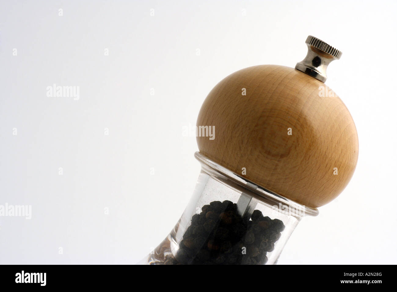 Glass pepper mill with wooden top Stock Photo Alamy