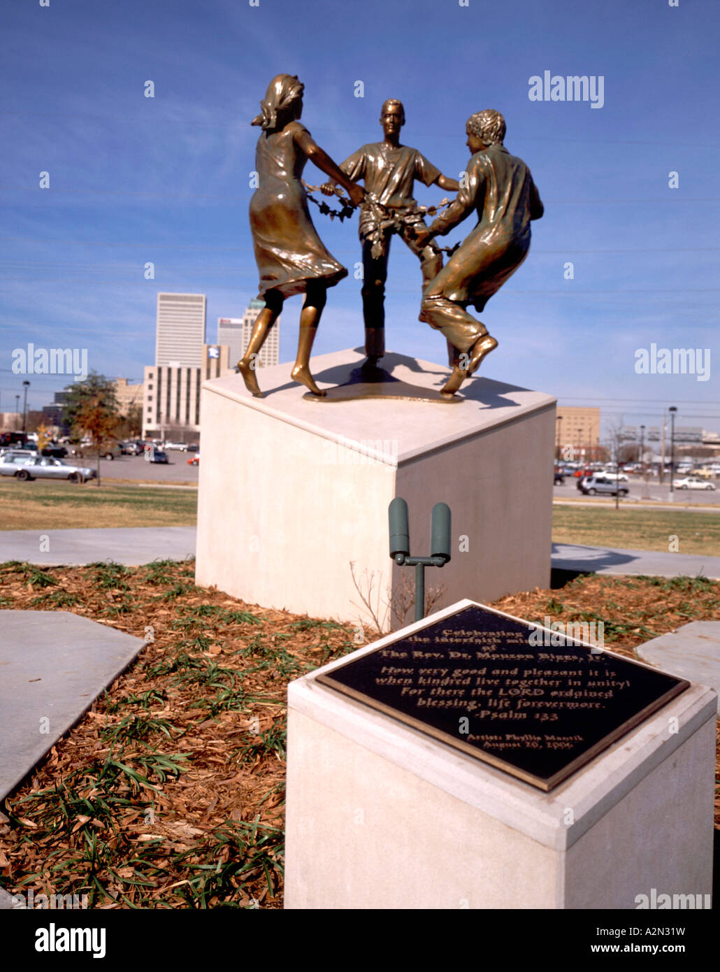 Tulsa Oklahoma.Bronze sculpture of 'kindred living together' in park outside United Methodist Church Stock Photo