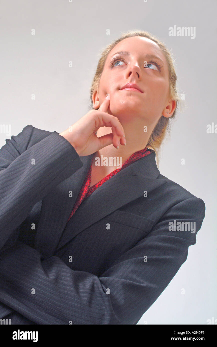 Woman in business suit on white background Stock Photo - Alamy