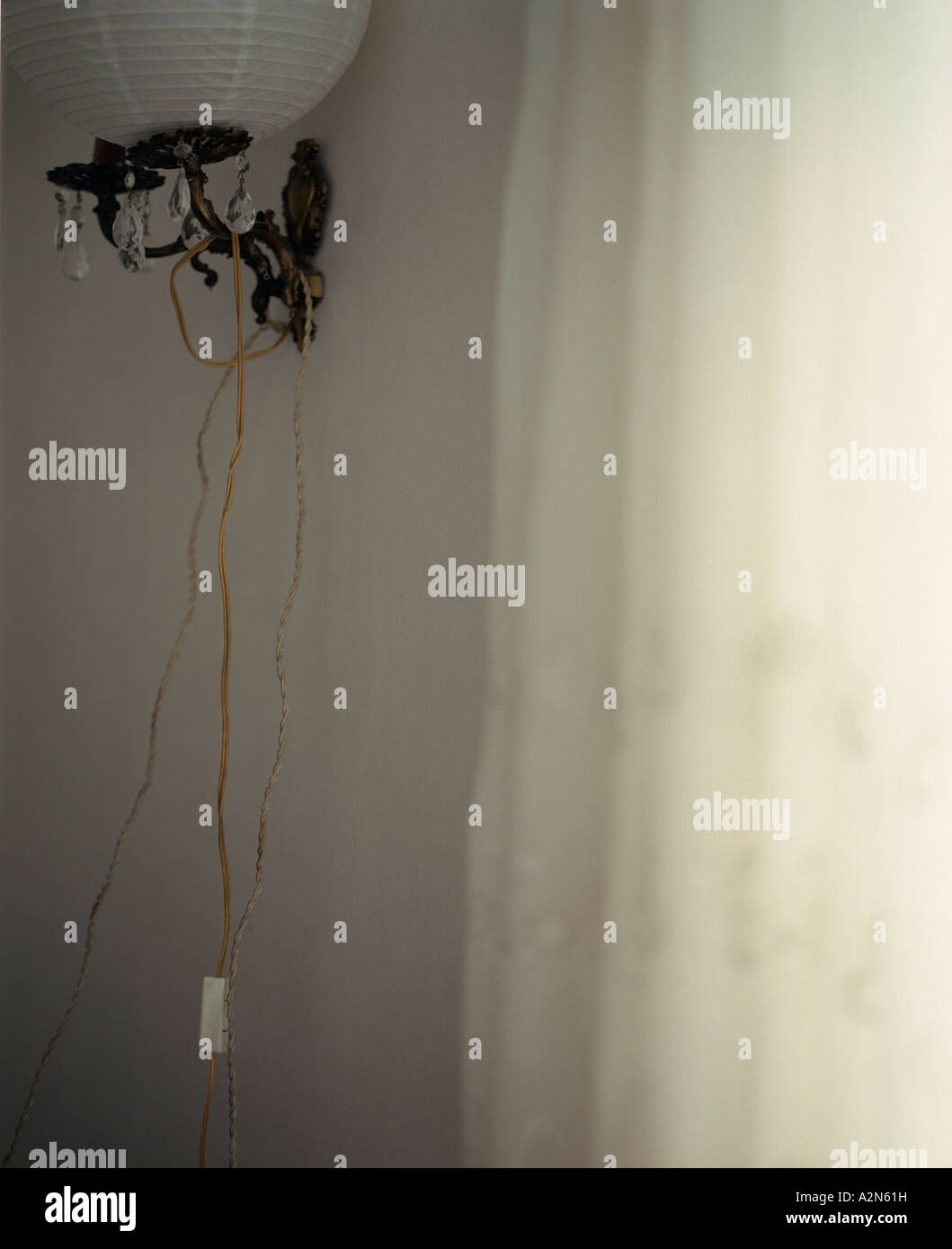 Side profile of lantern and curtain Stock Photo