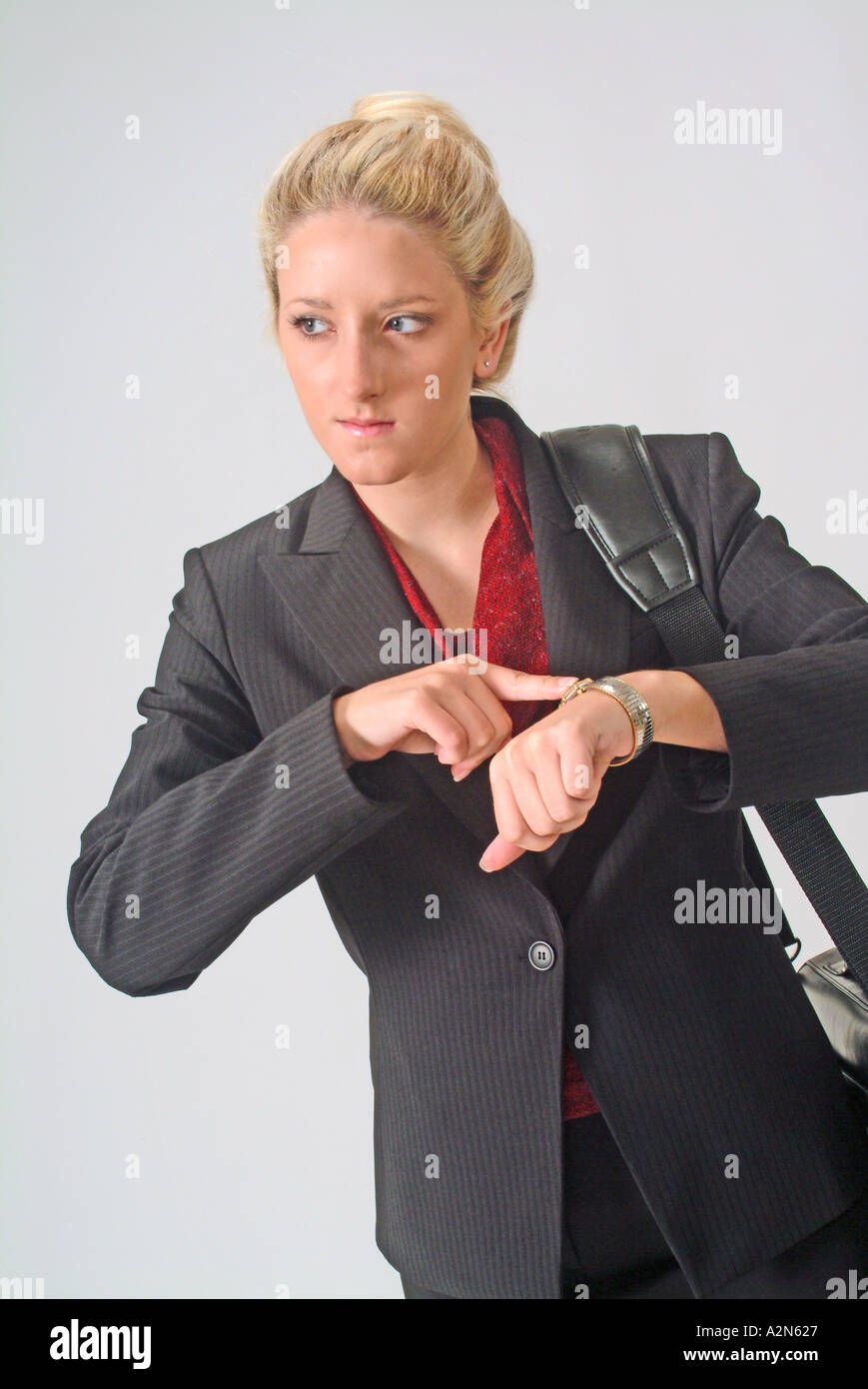 Woman in business suit on white background Stock Photo - Alamy