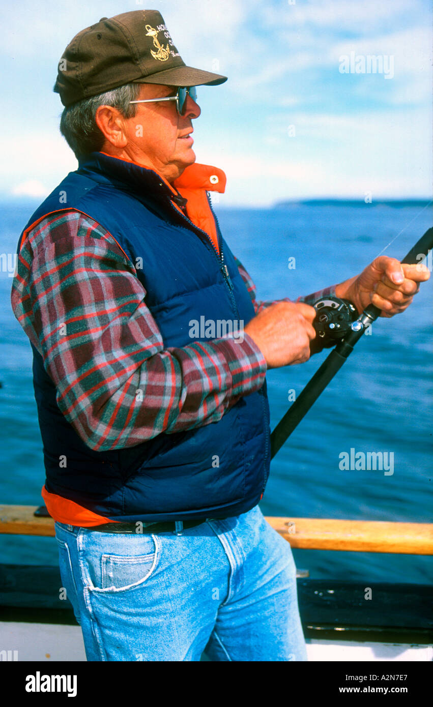 Man fishing for Pacific Halibut off Alaska USA Stock Photo