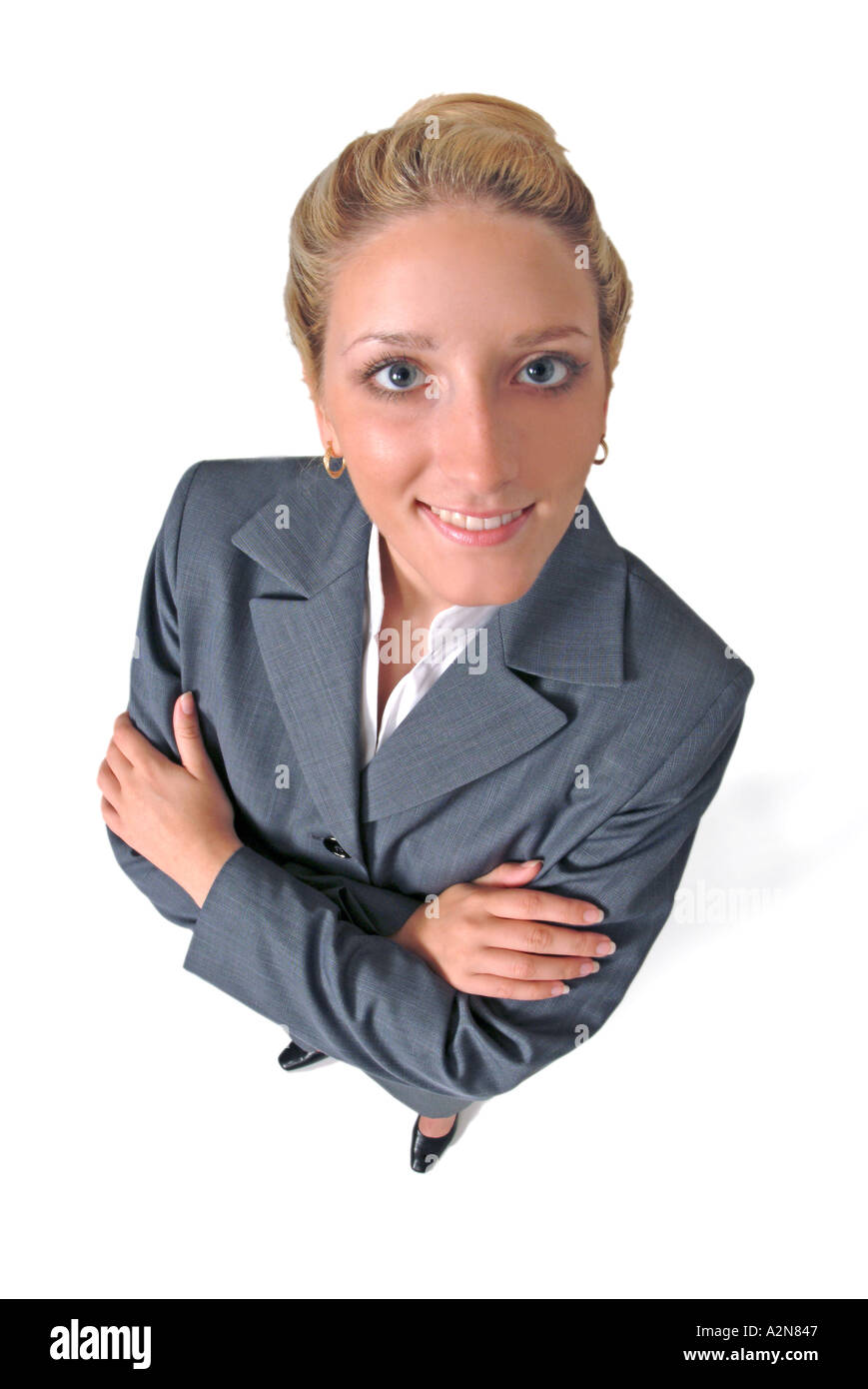 Businesswoman in business suit standing on white background looking up ...