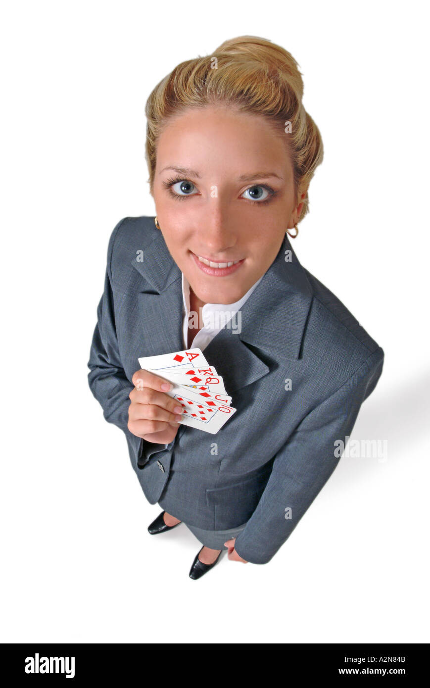 Businesswoman in business suit standing on white background holding ...