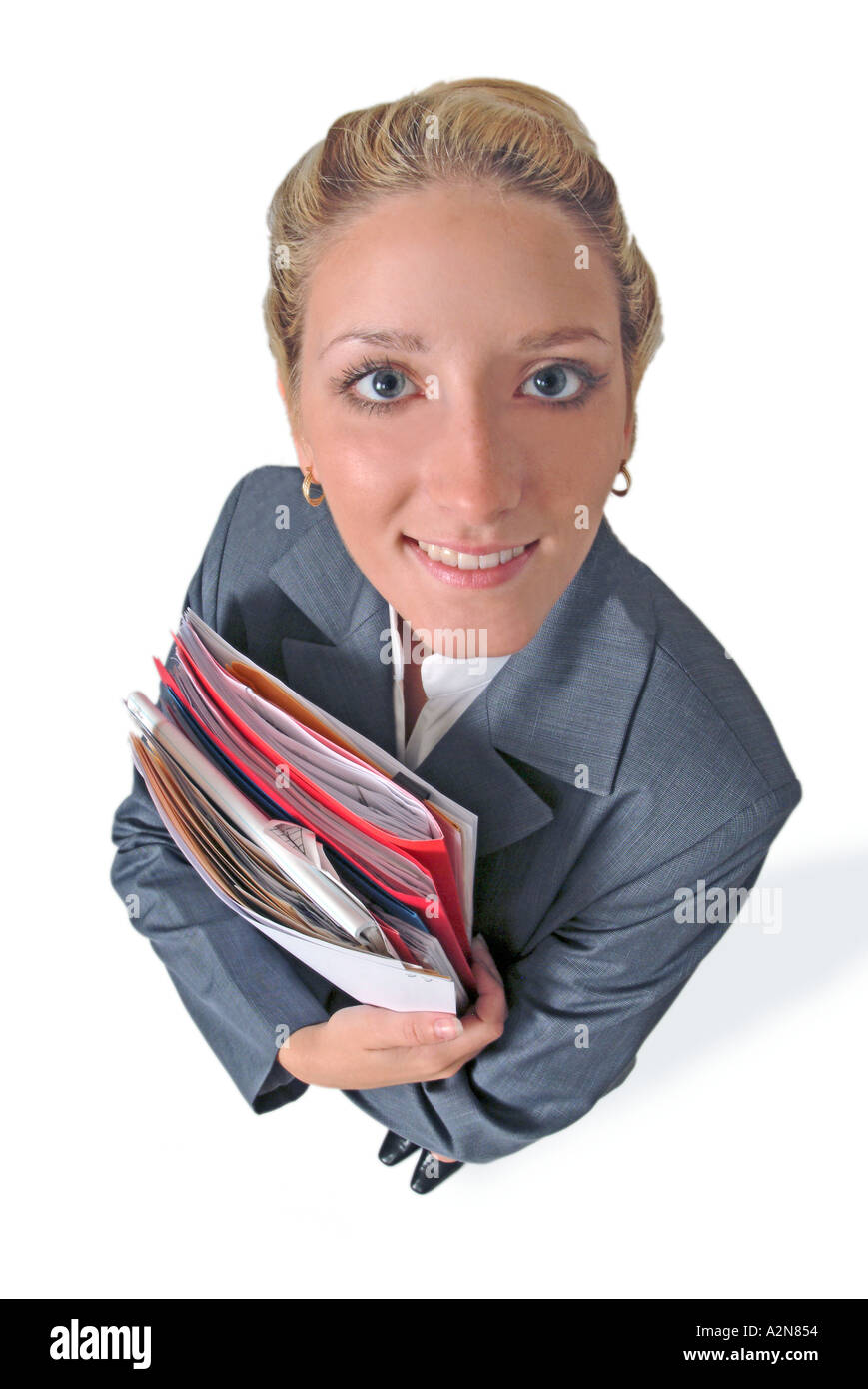 Businesswoman in business suit standing on white background looking up ...
