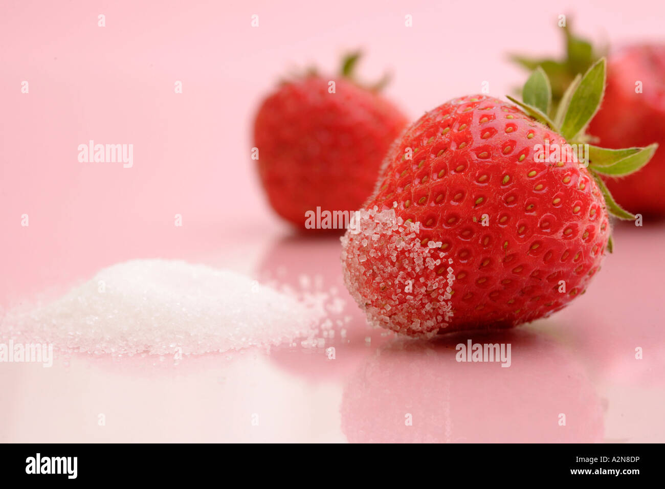 Close-up of strawberry and sugar Stock Photo - Alamy
